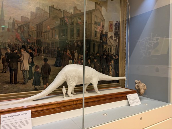 Image of dinosaur statue in Andrew Carnegie Birth Museum