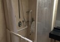 Accessible Shower, slight lip to get in.