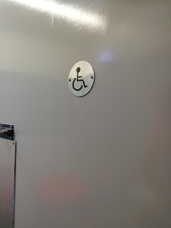 disabled sign on toilet door