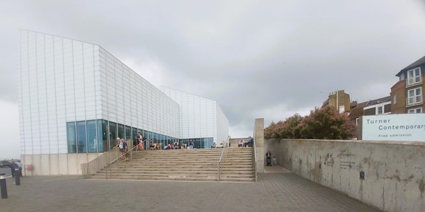 Image of a building with stairs leading to the entrance