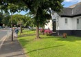 Image of a white building with a ramp