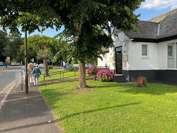 Image of a white building with a ramp