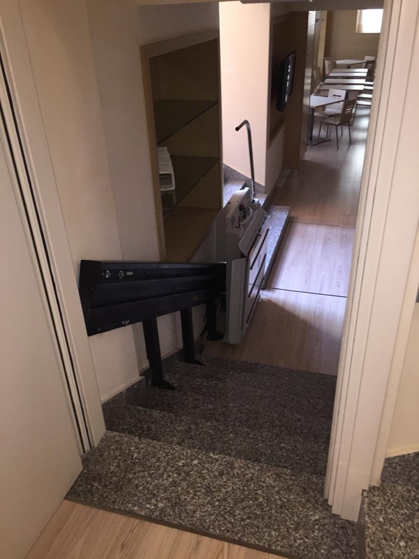 Stair lift down to conference room and to the lift to access the reception area