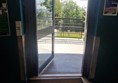 Image of the automatic door opening taken from within the foyer