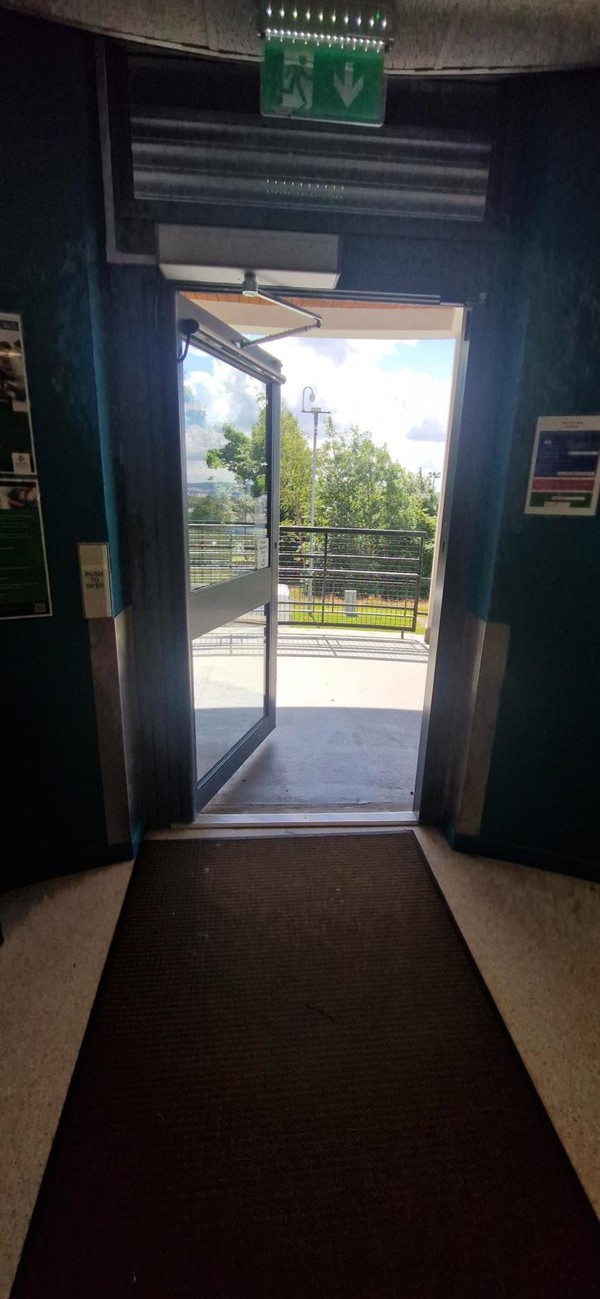 Image of the automatic door opening taken from within the foyer