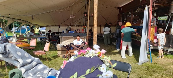 Image of people in a tented area