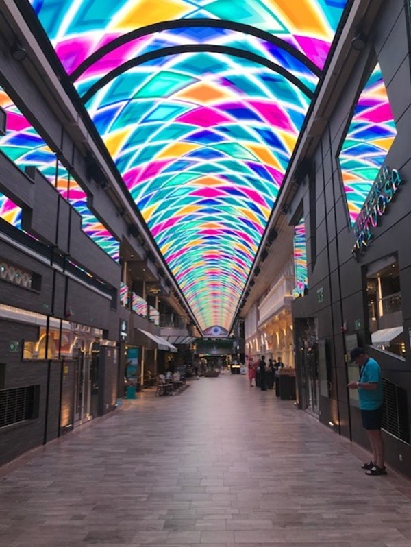 The main walk way on the ship where the ceiling changed colour continuously.