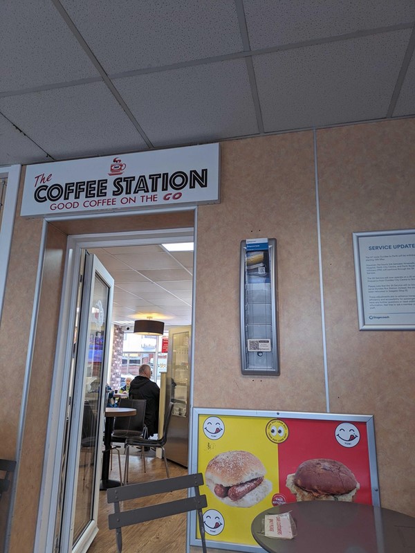 A coffee station sign in a restaurant