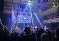 Image of an audience watching a band on stage