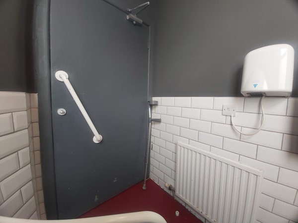 Image of a bathroom with a grey door