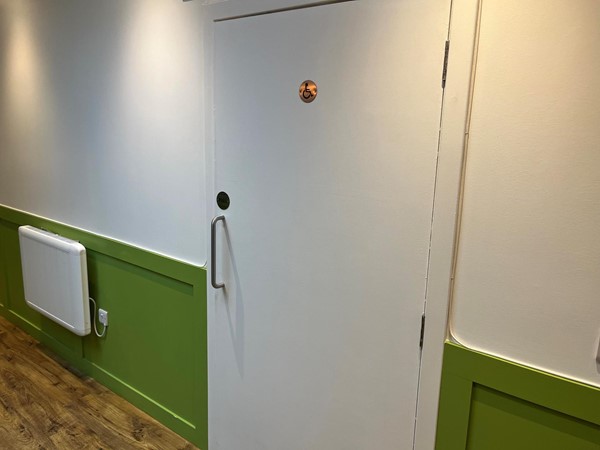 Image of an accessible toilet door