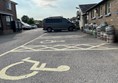 Image of a carpark with a wheelchair symbol painted on it