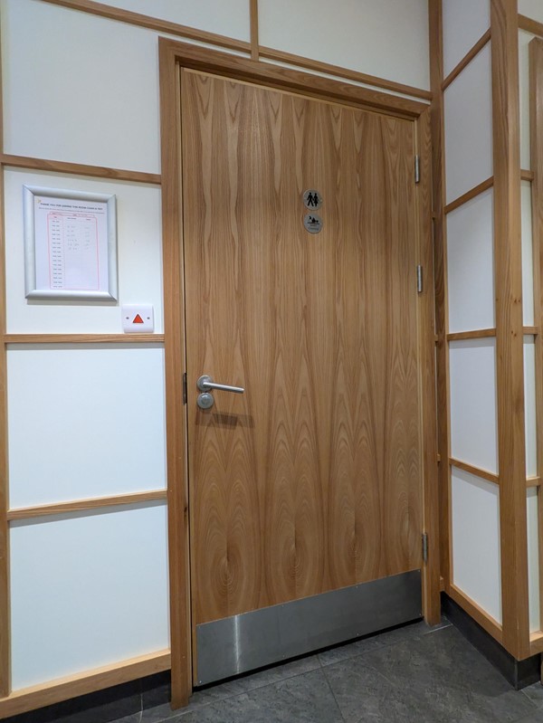 Image of a wooden door in a room