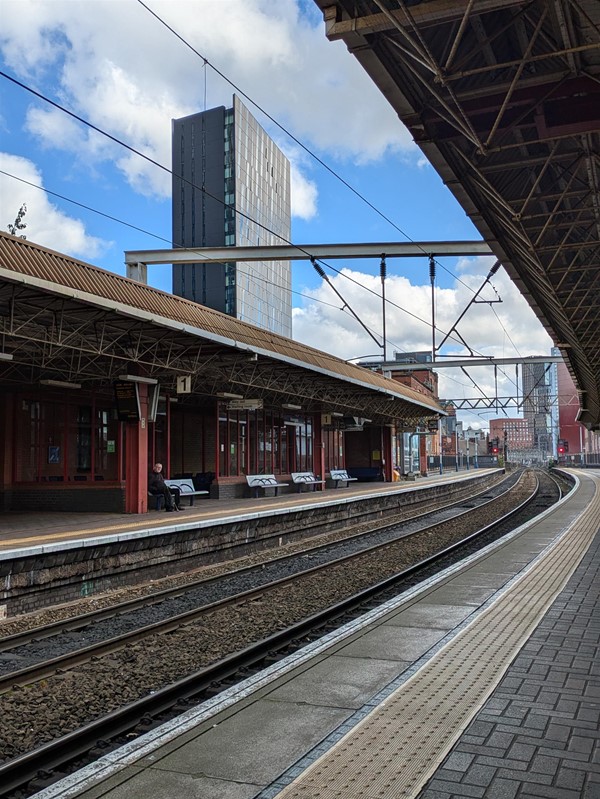 Image of train platform, there are no trains on the track.