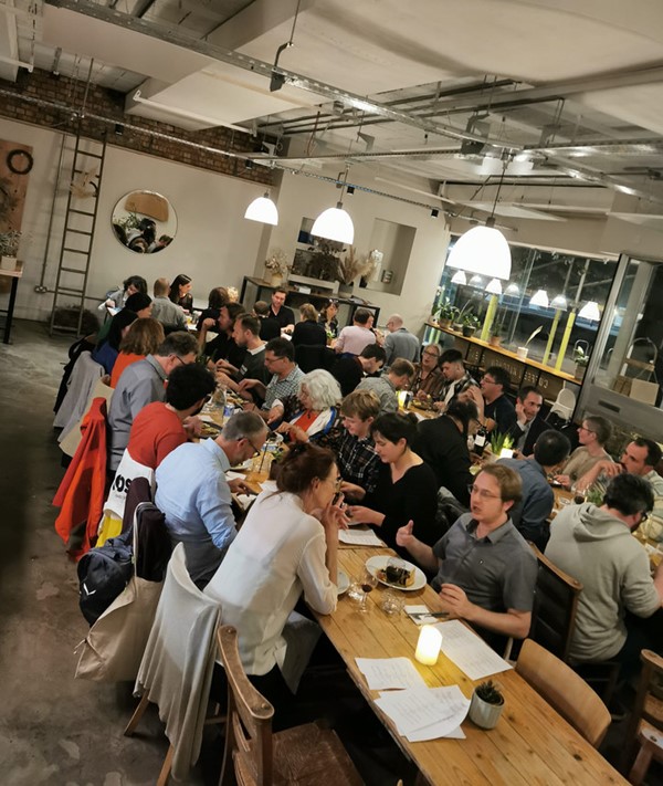 A group of people sitting at tables