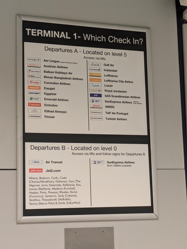 Image of a board explaining which check-in desk to use