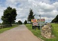 Image of a road with a sign on it