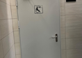 Image of an accessibe toilet door