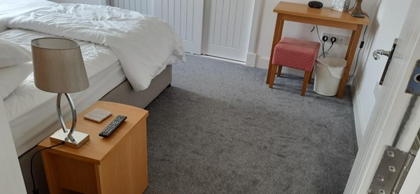 Picture of a bedside cupboard in a bed room