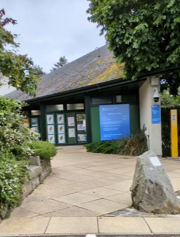 Image of a building with a sign on the front