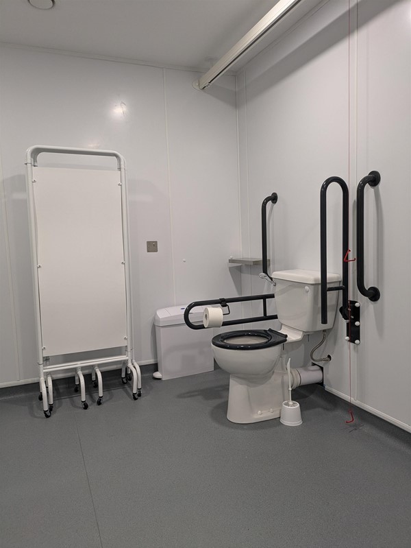 Image of toilet and privacy screen