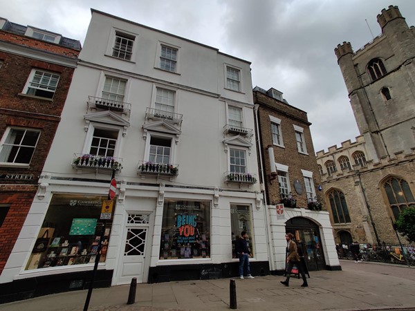 The shop as seen from Trinity Street, the step-free entrance is on the right-hand side within the white arch.