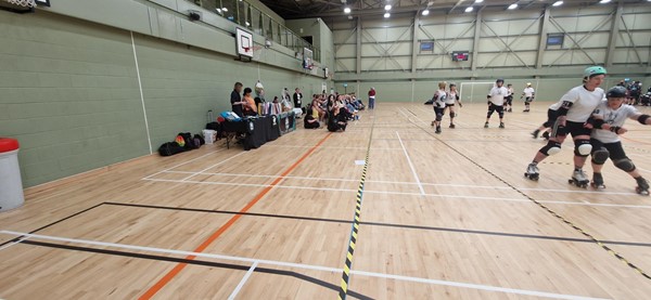 Image of spectators watching roller derby within the DISC main hall.