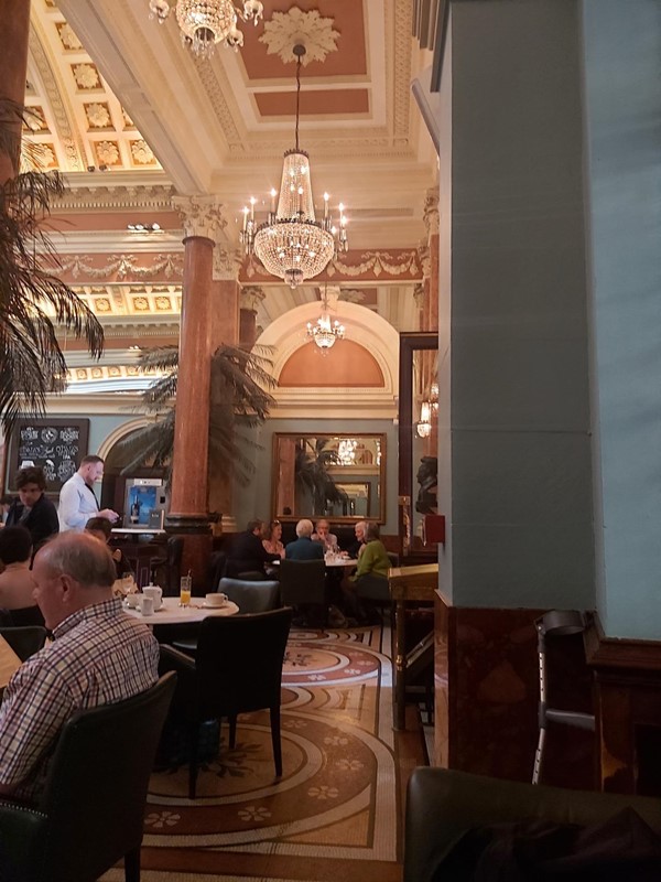 Image of a group of people sitting at tables in a restaurant