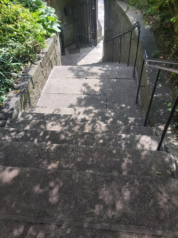 stone stairs with metal railings