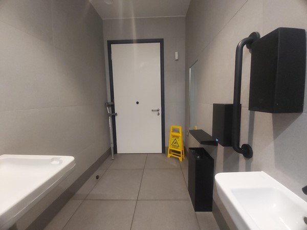 Image of a bathroom with a door and sink