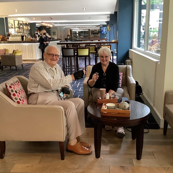 Drinking tea and coffee at a table in the lounge area