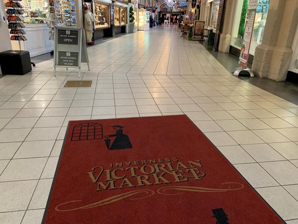 Rug saying "Victorian Market"