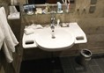 Accessible wash basin with built-in grab handles