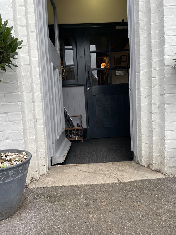 Image of an open doorway with a white frame