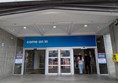 Image of the Union Street Entrance, a slight uneven slope. The words Trinity Centre appear above the entrance.