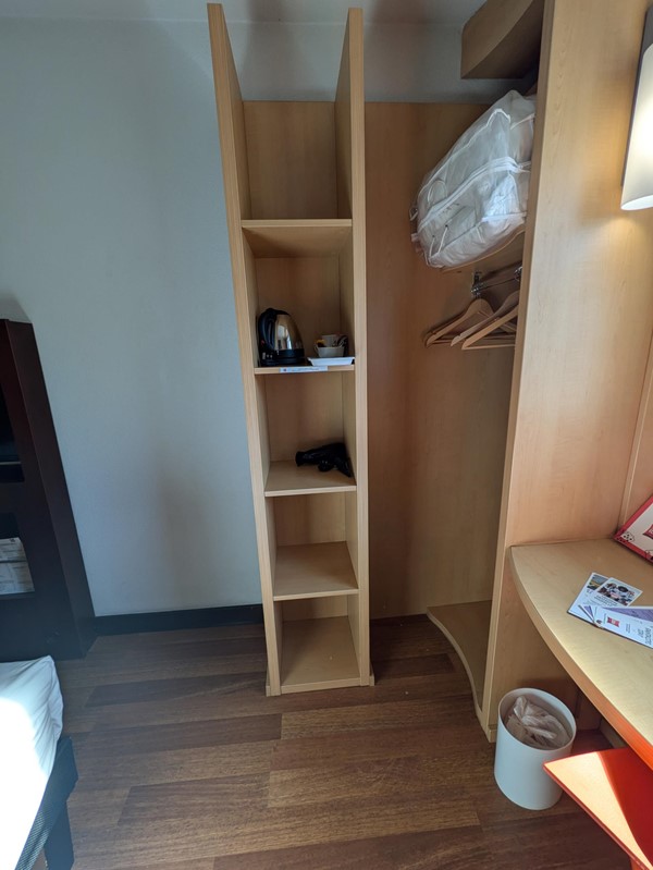 Image of shelves and the closet of the standard room