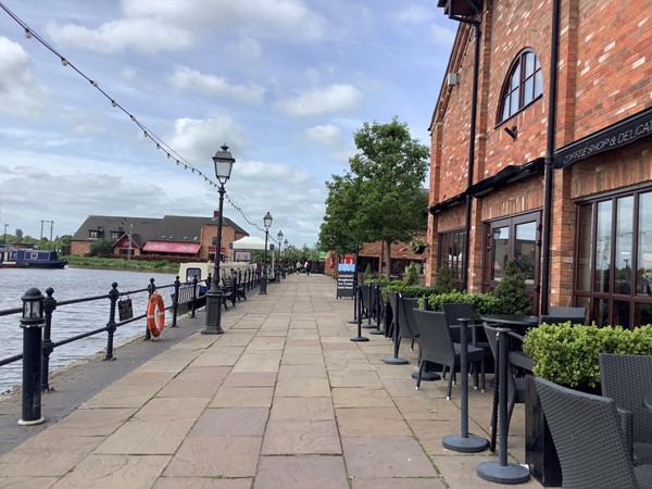 picture of a path going by a red brick building