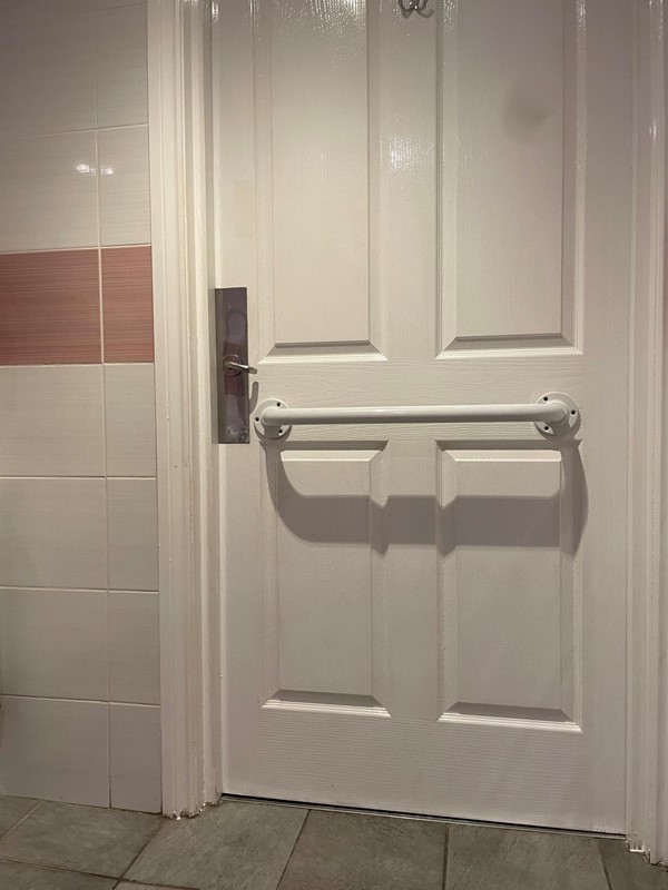 Image of a white door with a handle