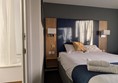 Image of bed in the accessible hotel room