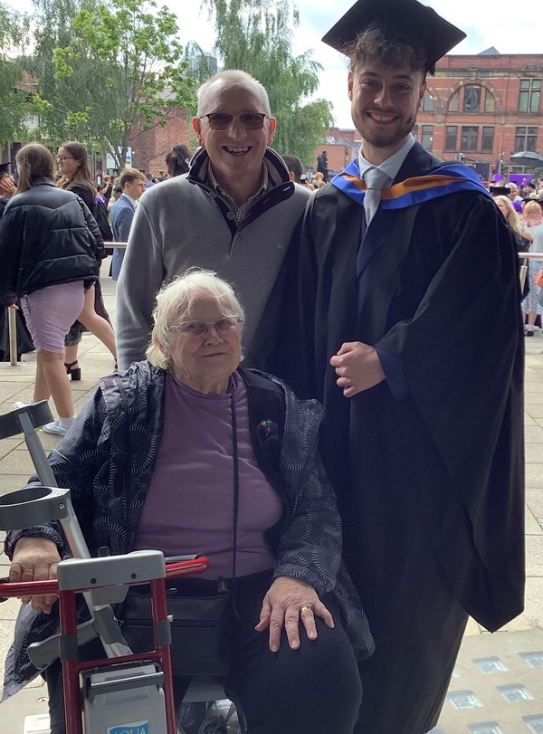 My husband and I with my lovely grandson on his graduation. Proud grandparents