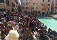 Photo of crowds at the Trevi fountain.