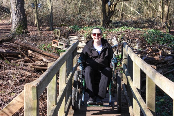 Narrow bridge with mountain trike on it.