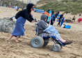 Image of a wheelchair user on a beach