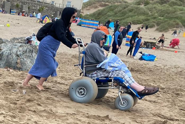 Image of a wheelchair user on a beach