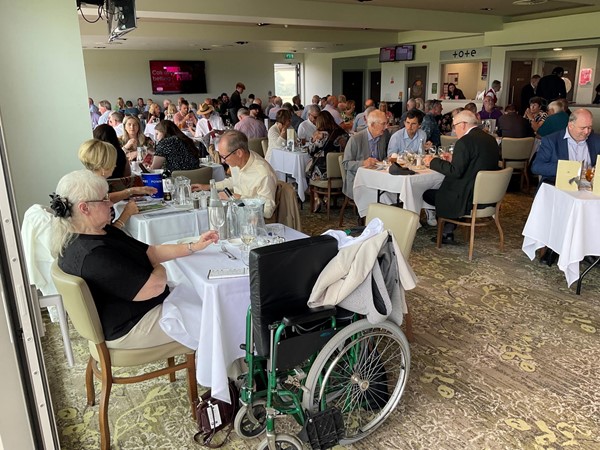 Image of a group of people sitting around a table