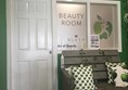 Image of the outside the outside of Art of Beauty's treatment room showing the door entrance.