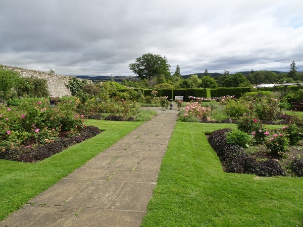 Level slabbed pathway in walled gardens