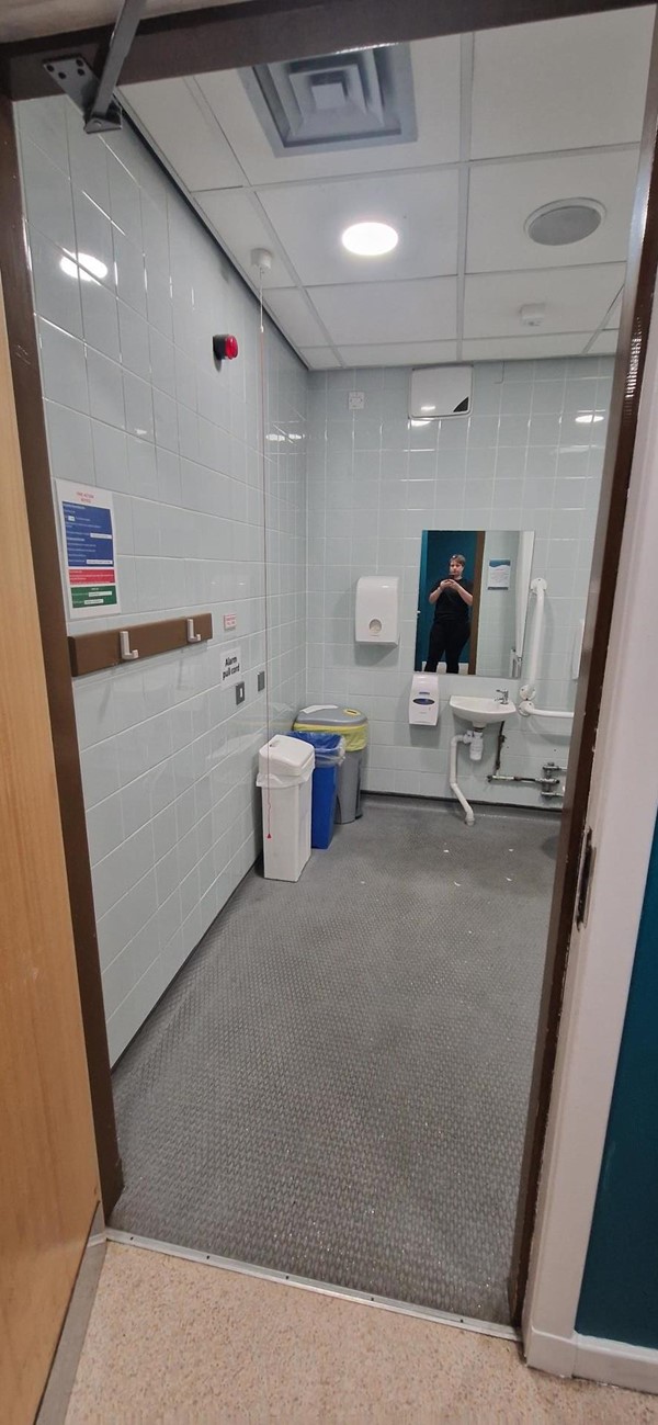 Image of accessible toilet with a door open