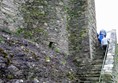 Picture of a sign by the castle wall