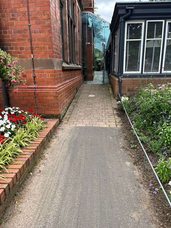 Image of a path by a building